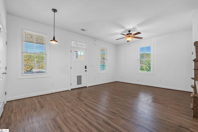 unfurnished living room with ceiling fan and dark hardwood / wood-style flooring