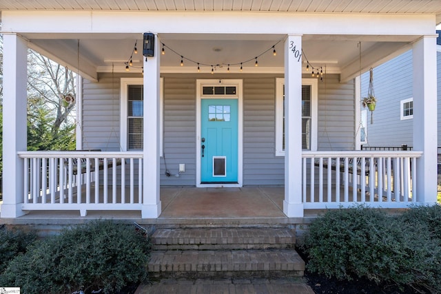 entrance to property featuring covered porch