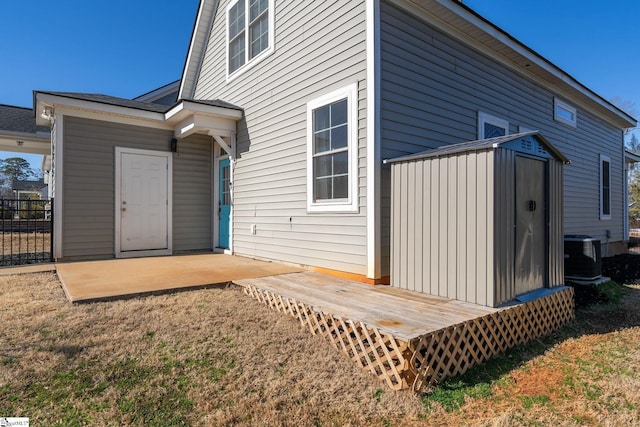 rear view of house with a patio area and central air condition unit