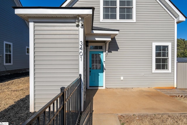 property entrance with a patio