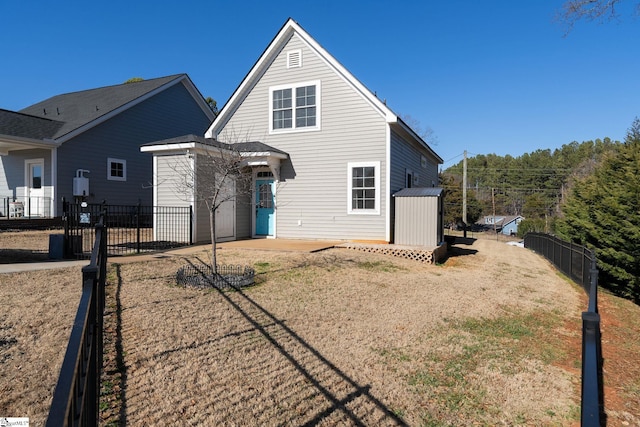 back of property featuring a lawn