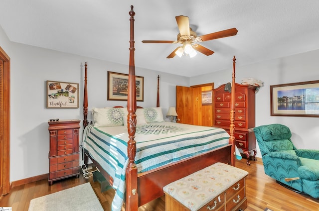 bedroom with light hardwood / wood-style flooring and ceiling fan