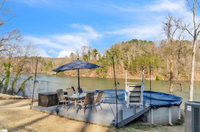 dock area with central AC unit and a water view