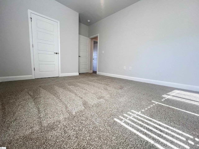 unfurnished bedroom featuring carpet flooring