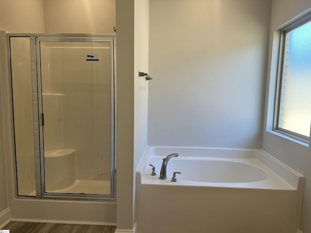 bathroom with separate shower and tub