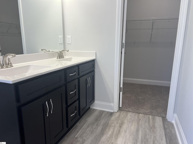 bathroom featuring hardwood / wood-style flooring and vanity