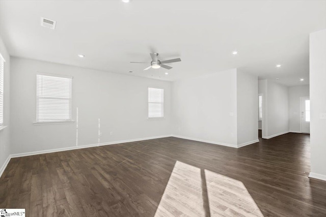 unfurnished room with dark wood-style flooring, recessed lighting, visible vents, ceiling fan, and baseboards