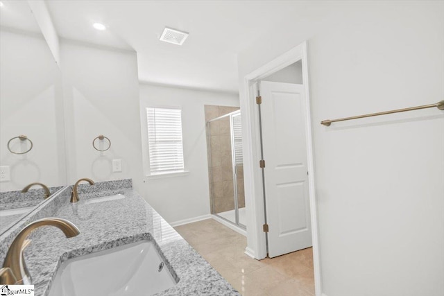 full bathroom featuring a shower stall, visible vents, and a sink