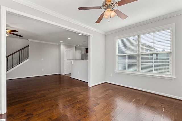 unfurnished living room with crown molding, dark wood-type flooring, and ceiling fan