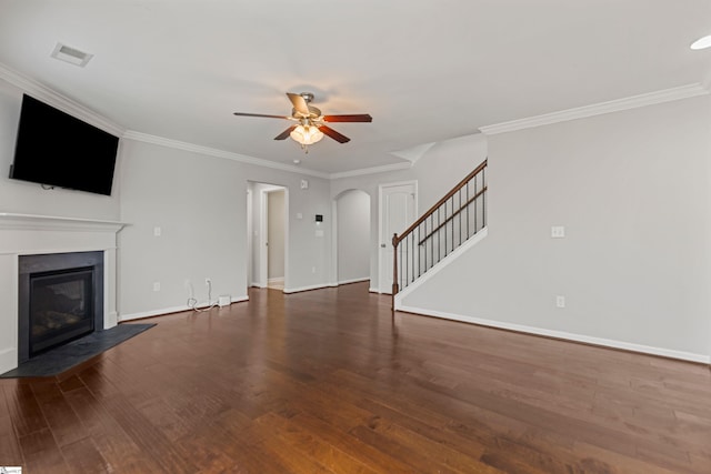 unfurnished living room with crown molding, dark hardwood / wood-style floors, and ceiling fan