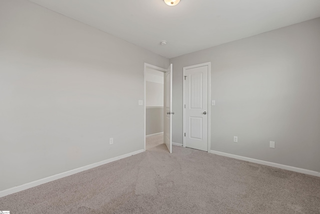 unfurnished bedroom with light carpet