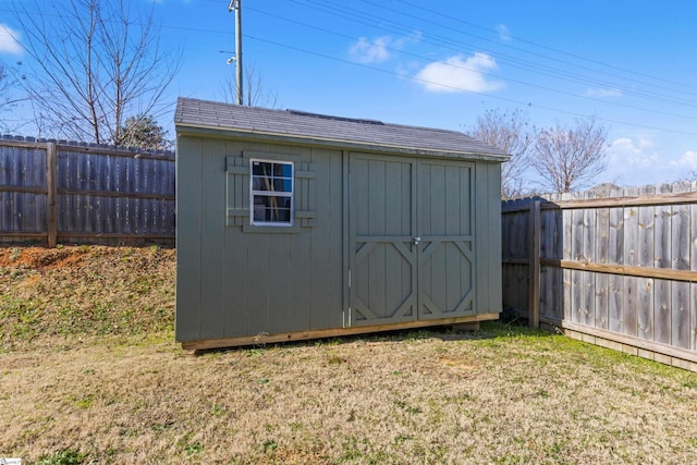 view of outbuilding featuring a lawn