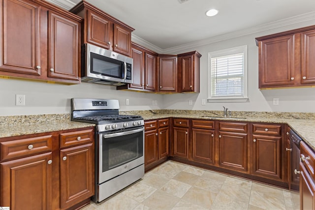 kitchen with crown molding, appliances with stainless steel finishes, sink, and light stone counters