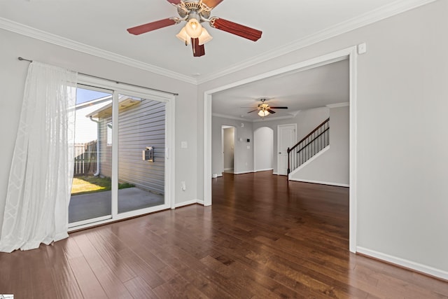 unfurnished room with ornamental molding, dark wood-type flooring, and ceiling fan