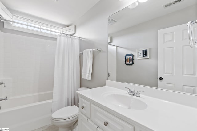 full bathroom with vanity, shower / bath combo, and toilet