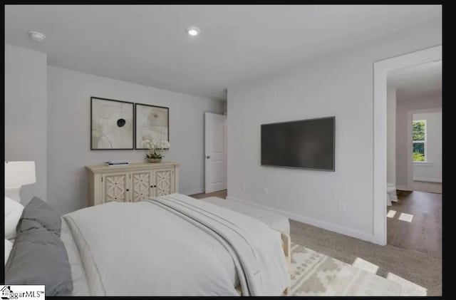 bedroom with light carpet