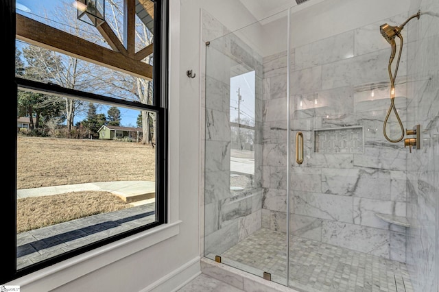 bathroom with a shower with shower door