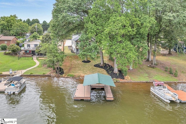 view of dock with a water view and a yard