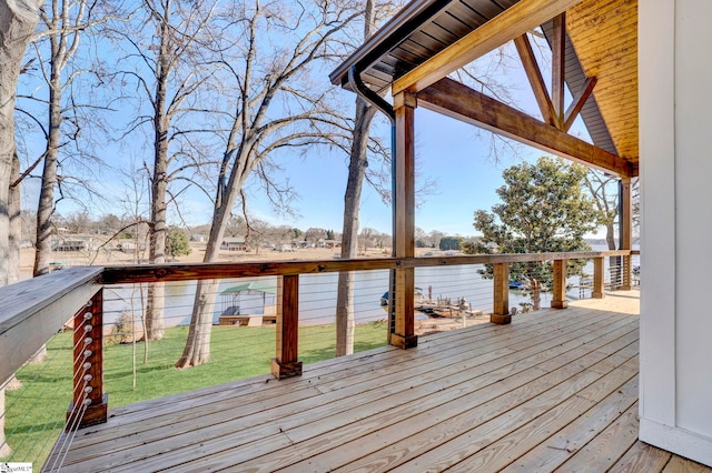 wooden deck featuring a water view