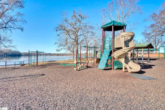 view of playground with a water view