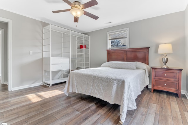 bedroom featuring wood-type flooring and ceiling fan