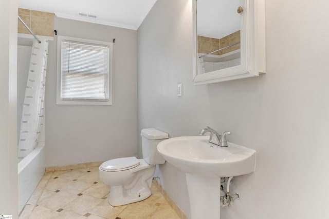 bathroom with tile patterned flooring, shower / bath combination with curtain, and toilet