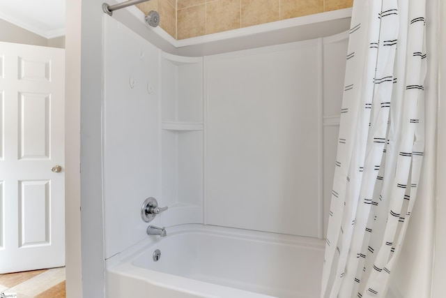 bathroom featuring shower / bathtub combination with curtain