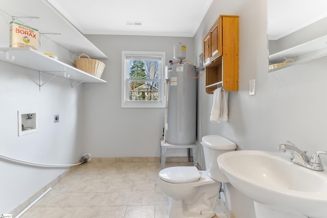 bathroom featuring sink, water heater, tile patterned flooring, ornamental molding, and toilet