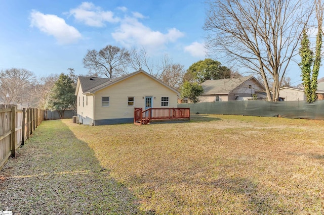 exterior space featuring a wooden deck and a yard