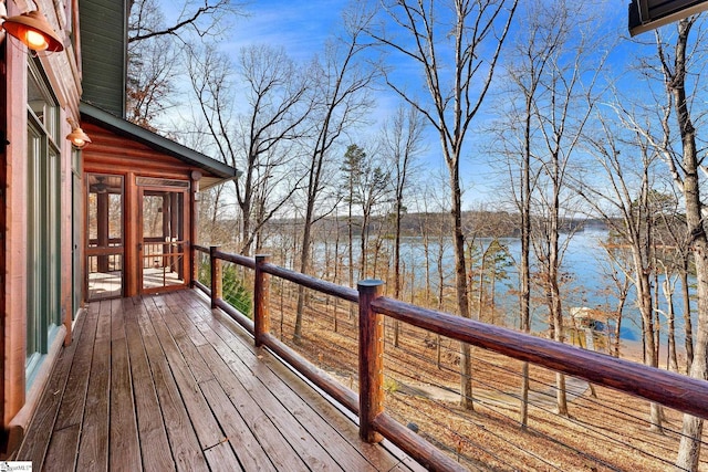 wooden deck featuring a water view and a sunroom