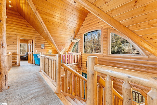 interior space with lofted ceiling, light carpet, and wooden ceiling