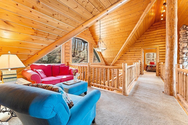 living room with lofted ceiling with beams, rustic walls, carpet flooring, and wooden ceiling