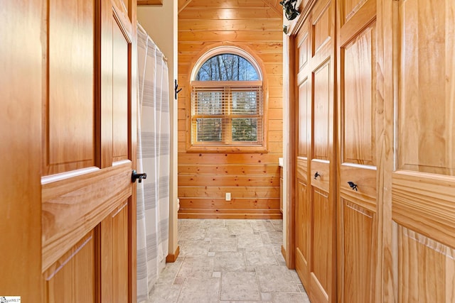 interior space featuring wooden walls