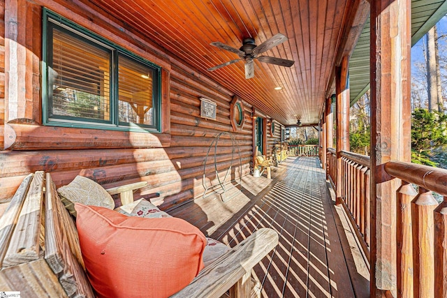 deck featuring ceiling fan and a porch