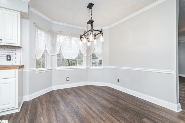 unfurnished dining area featuring dark hardwood / wood-style flooring and ornamental molding