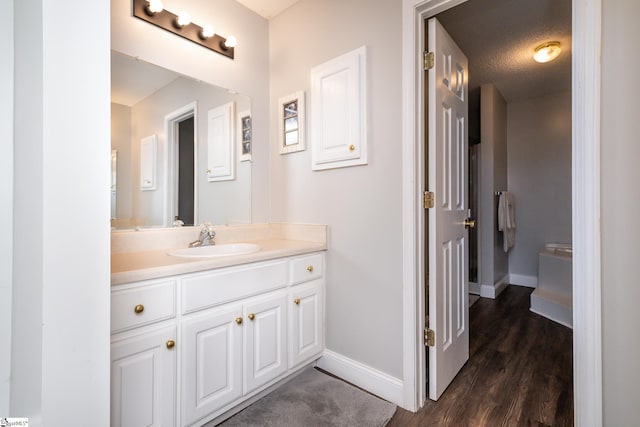 bathroom with vanity and hardwood / wood-style floors