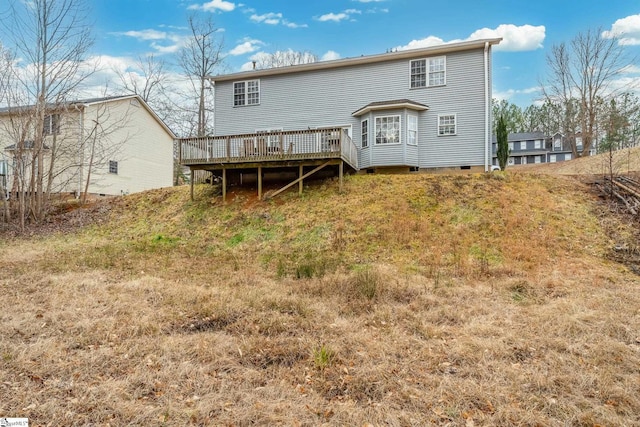 rear view of property with a wooden deck