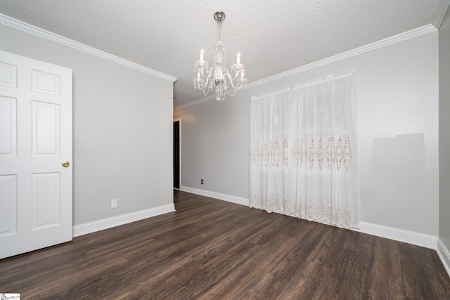 empty room with ornamental molding, dark hardwood / wood-style flooring, a chandelier, and a textured ceiling