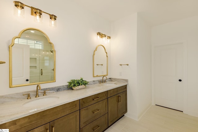 bathroom with vanity and a shower with door