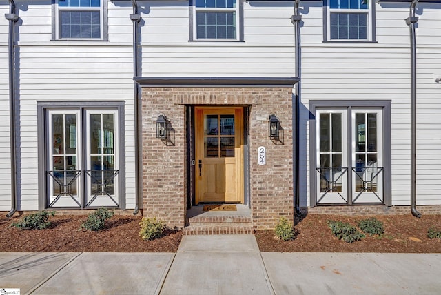 doorway to property featuring french doors