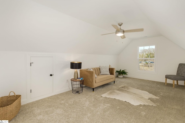 living area featuring vaulted ceiling, light carpet, and ceiling fan