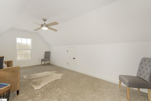 sitting room featuring vaulted ceiling, carpet, and ceiling fan