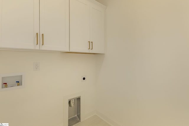 washroom featuring cabinets, hookup for a washing machine, and electric dryer hookup