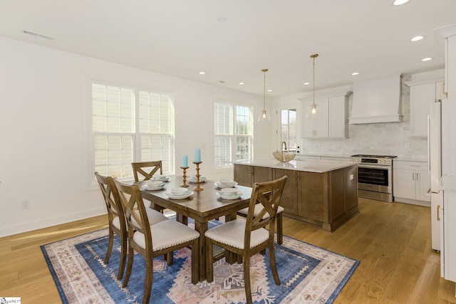 dining room with light wood-type flooring