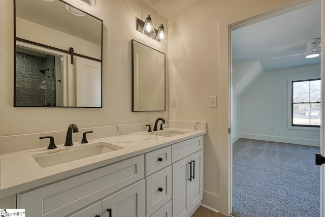 bathroom with vanity, vaulted ceiling, and ceiling fan