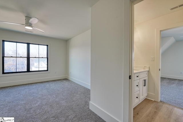 interior space featuring ceiling fan