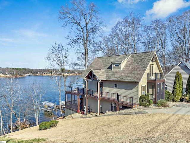 view of dock with a water view and a balcony