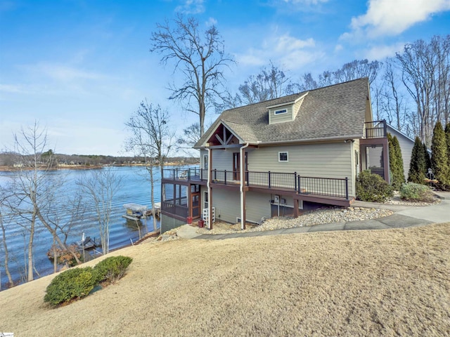 view of dock with a deck with water view