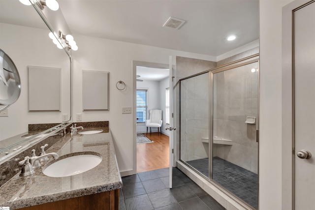 bathroom with vanity and walk in shower