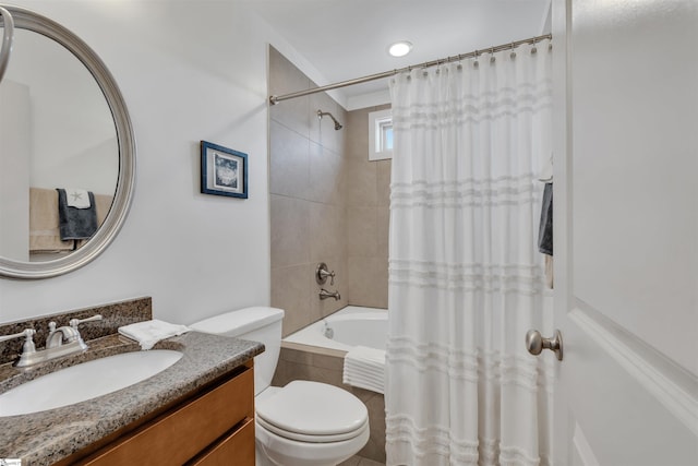 full bathroom with shower / bath combo, vanity, and toilet